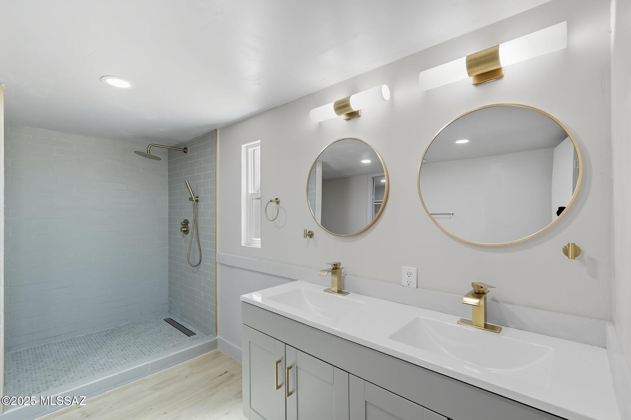 8790 North Trico Road Marana, AZ 85653 - Photo 15 of 35 a bathroom with a sink and a mirror