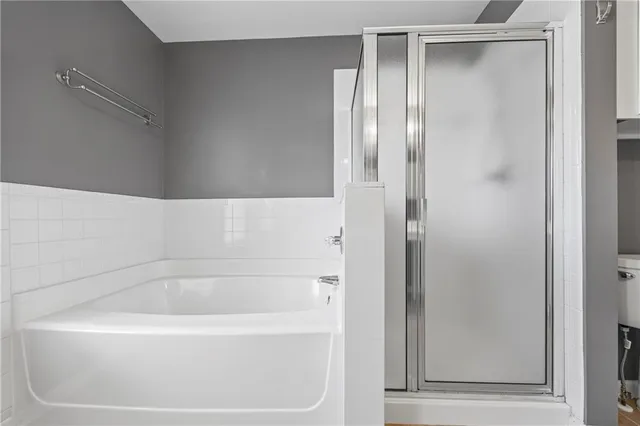 a white bath tub sitting next to a window