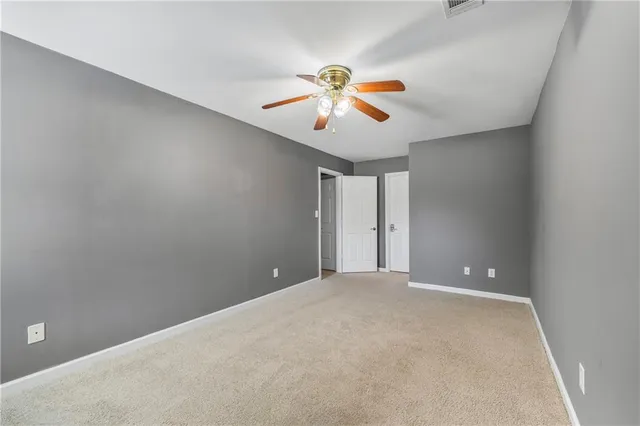 a balcony with wooden floor and fence