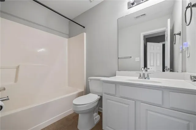 a balcony with wooden floor and fence