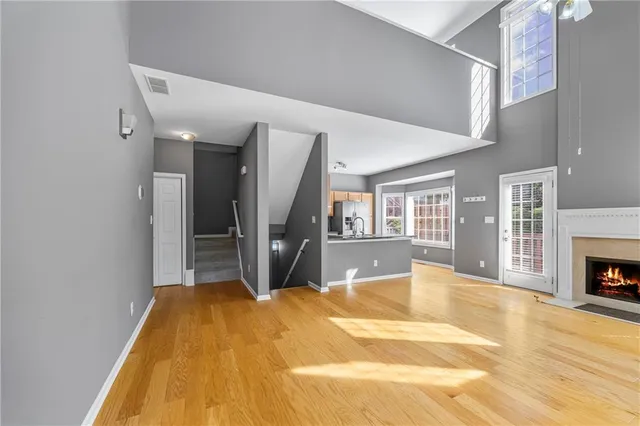 a spacious bedroom with a bed and a fireplace