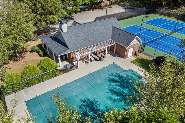 a view of front door of house with a garden