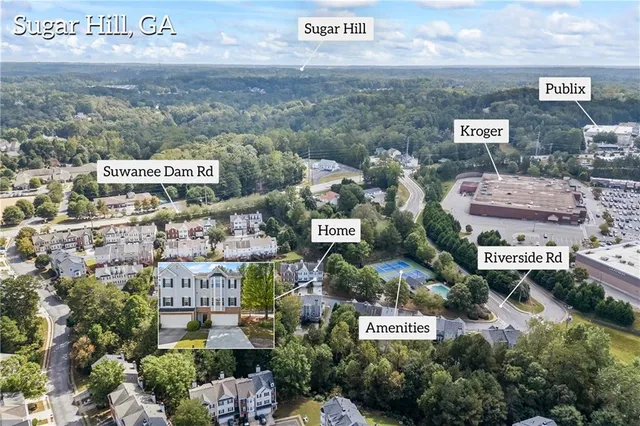 an aerial view of a house with swimming pool outdoor seating and yard