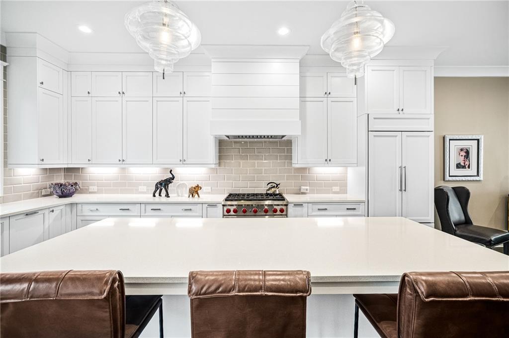 3715 Peachtree Road, Unit 2 Atlanta, GA 30319 - Photo 17 of 51 a kitchen with stainless steel appliances a stove a sink and cabinets