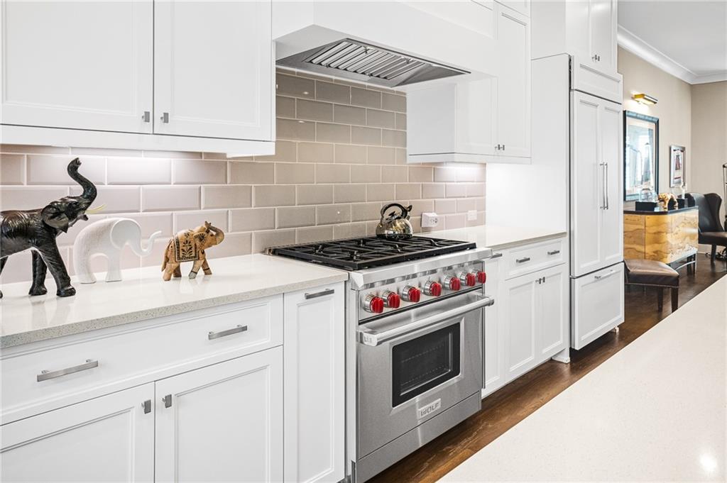 3715 Peachtree Road, Unit 2 Atlanta, GA 30319 - Photo 20 of 51 a kitchen with a stove and white cabinets
