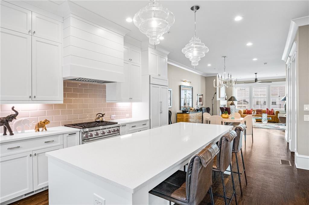 3715 Peachtree Road, Unit 2 Atlanta, GA 30319 - Photo 24 of 51 a large kitchen with a table and chairs
