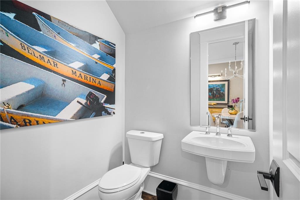 3715 Peachtree Road, Unit 2 Atlanta, GA 30319 - Photo 27 of 51 a bathroom with a toilet a sink and mirror