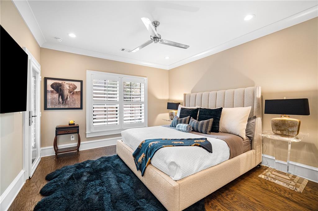 3715 Peachtree Road, Unit 2 Atlanta, GA 30319 - Photo 28 of 51 a bed room with a bed a couch and a flat screen tv