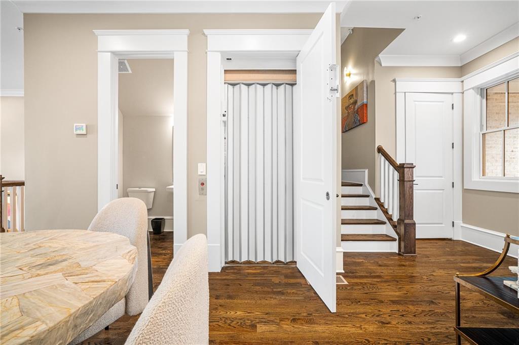 3715 Peachtree Road, Unit 2 Atlanta, GA 30319 - Photo 32 of 51 a bedroom with a bed and wooden floor