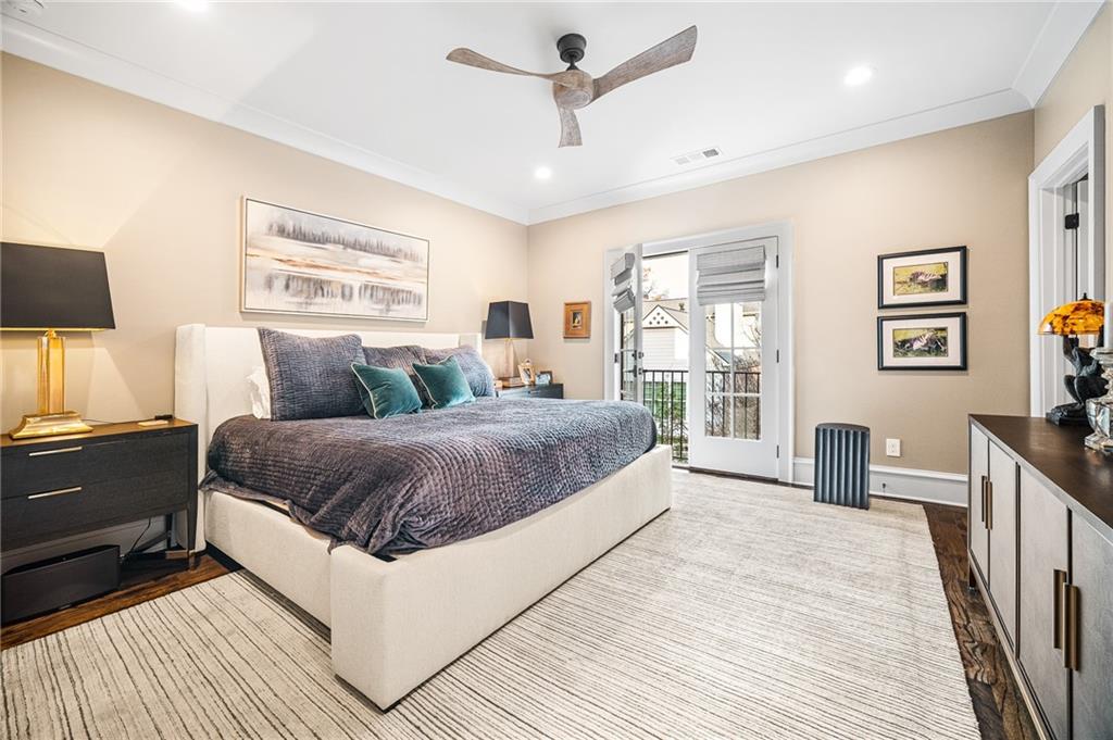 3715 Peachtree Road, Unit 2 Atlanta, GA 30319 - Photo 36 of 51 a bedroom with a large bed and a chandelier