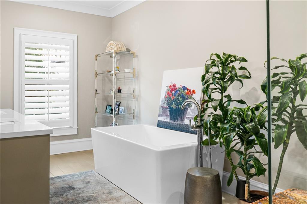 3715 Peachtree Road, Unit 2 Atlanta, GA 30319 - Photo 38 of 51 a dining room with furniture and a potted plant