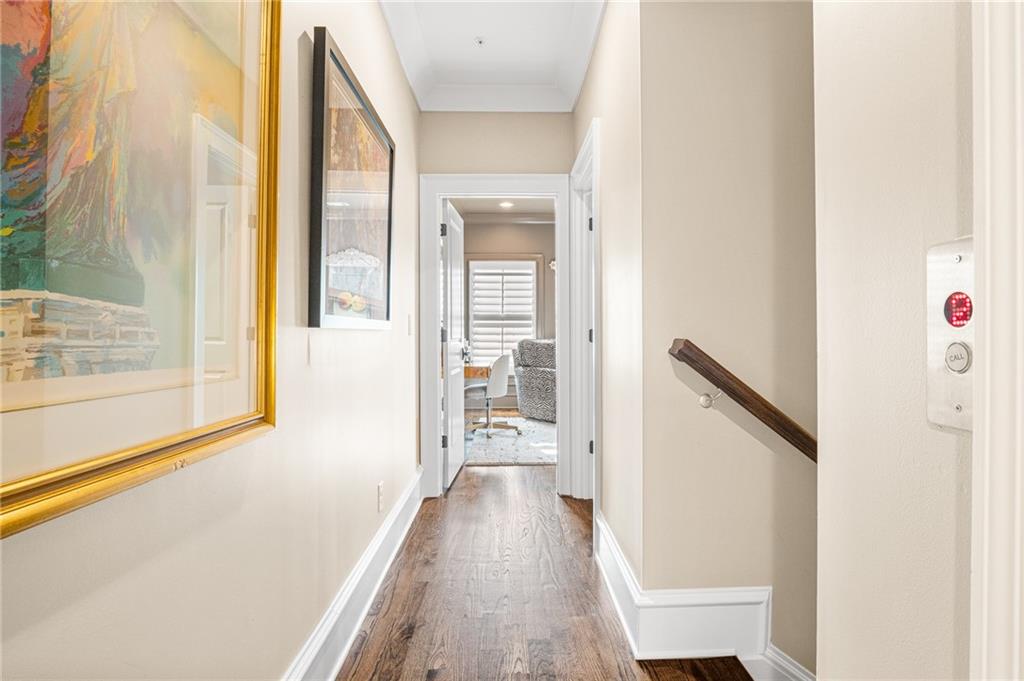 3715 Peachtree Road, Unit 2 Atlanta, GA 30319 - Photo 41 of 51 a view of a hallway with wooden floor and staircase