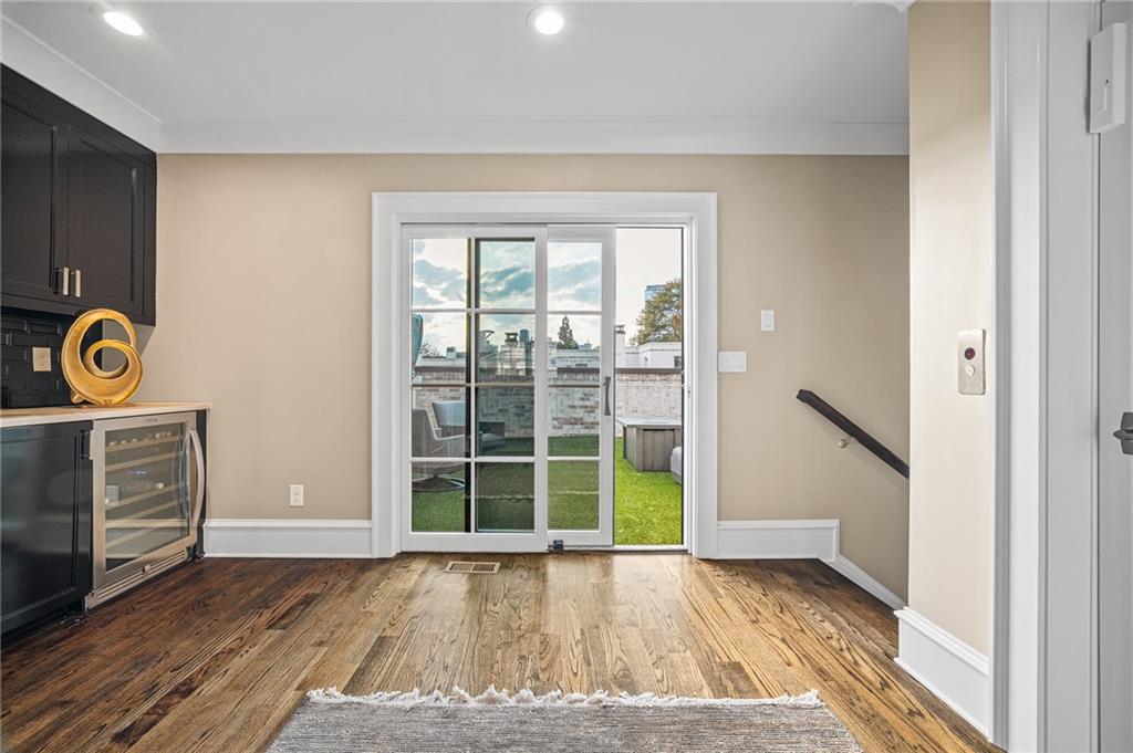3715 Peachtree Road, Unit 2 Atlanta, GA 30319 - Photo 45 of 51 a view of an empty room with a window and wooden floor