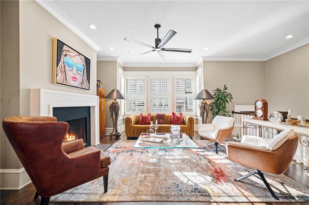 3715 Peachtree Road, Unit 2 Atlanta, GA 30319 - Photo 8 of 51 a living room with furniture a large window and a fireplace