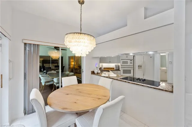 a very nice looking dining room with a table and chairs
