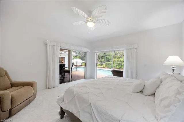 a large white bed in a white room