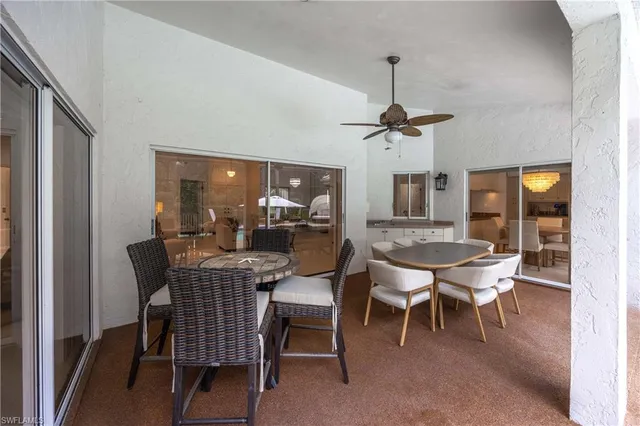 a dining room with furniture window and wooden floor