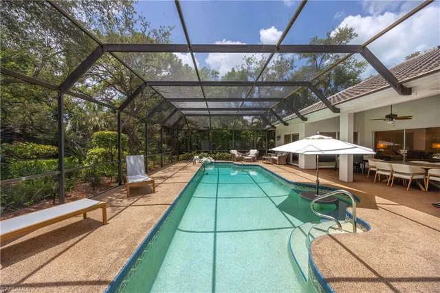 a view of a backyard with a patio and a patio