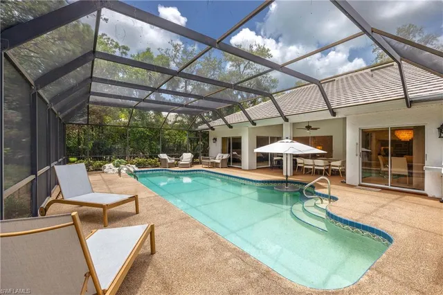 a view of a swimming pool with a patio