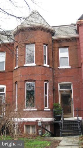 54 R Street Northeast Washington, DC 20002 - Photo 1 of 6 a front view of a brick house with yard