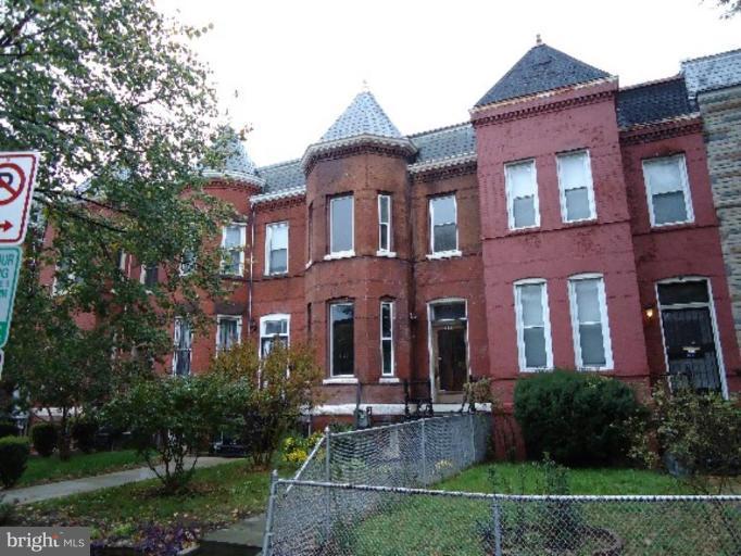 54 R Street Northeast Washington, DC 20002 - Photo 2 of 6 a front view of a house with yard and green space