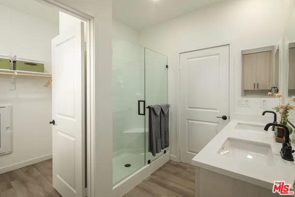 a bathroom with a sink and a large mirror