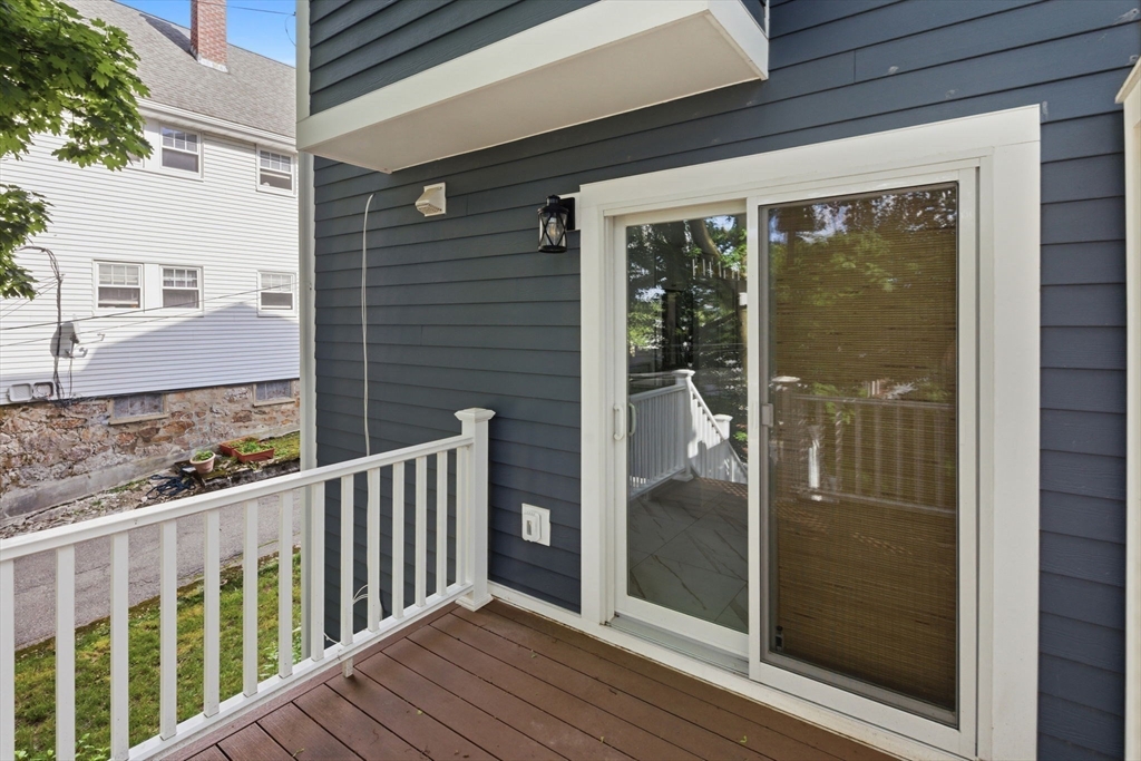 123 Nottinghill Road, Unit 2 Boston, MA 02135 - Photo 24 of 30 a view of a glass door and a window