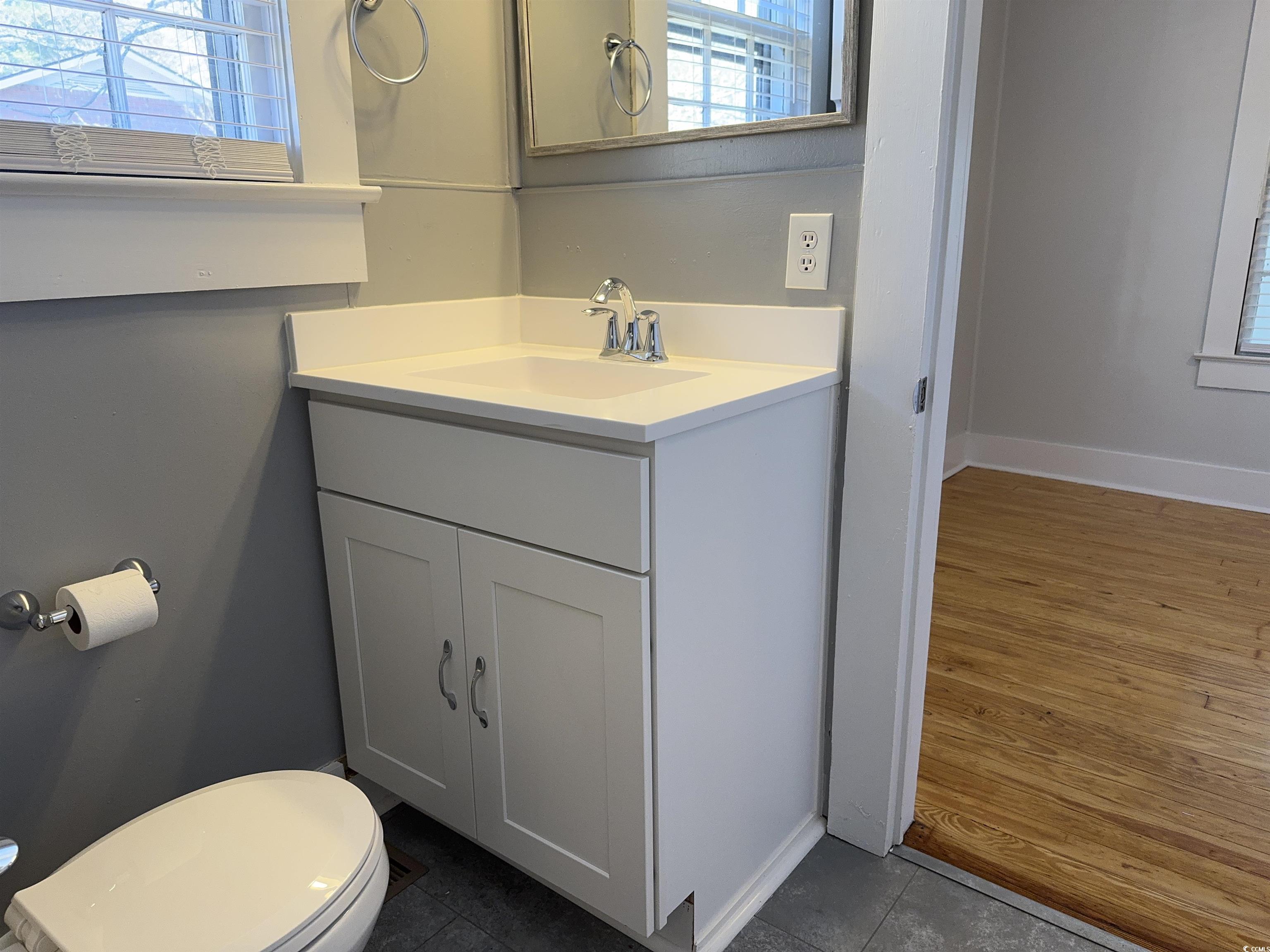 202 Lewis Street Mullins, SC 29574 - Photo 8 of 23 Bathroom featuring tile patterned floors, vanity,