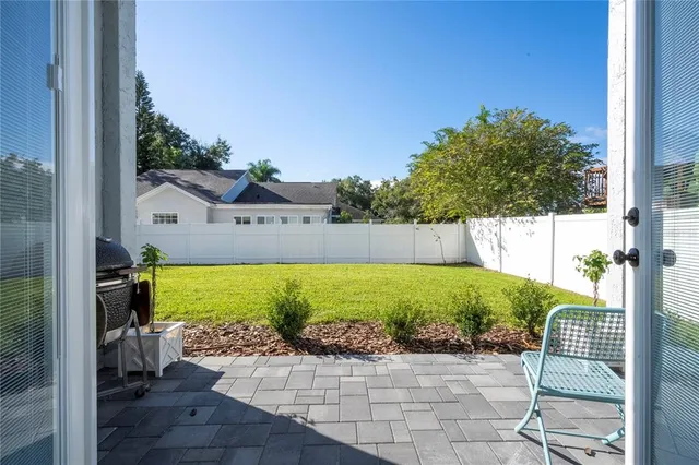 a front view of a house with yard and green space