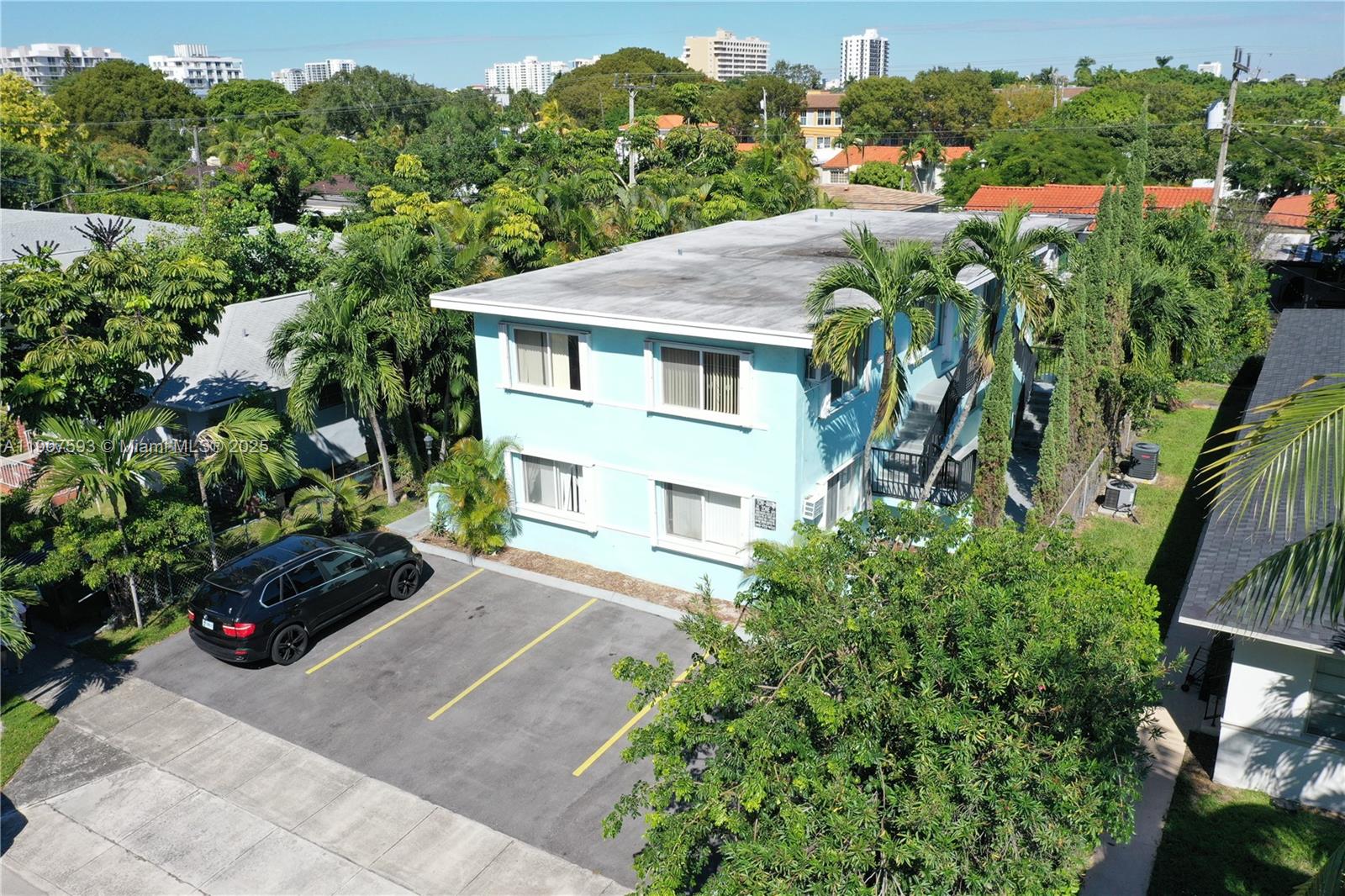 2465 Southwest 27th Street, Unit 2 Miami, FL 33133 - Photo 5 of 19 a view of a garden with a lot of plants and trees front of house