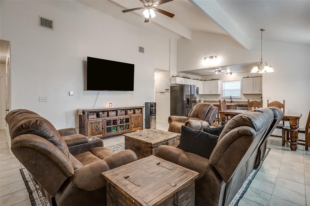 408 South Cleburne Whitney Road Rio Vista, TX 76093 - Photo 5 of 16 a living room with furniture kitchen and a flat screen tv