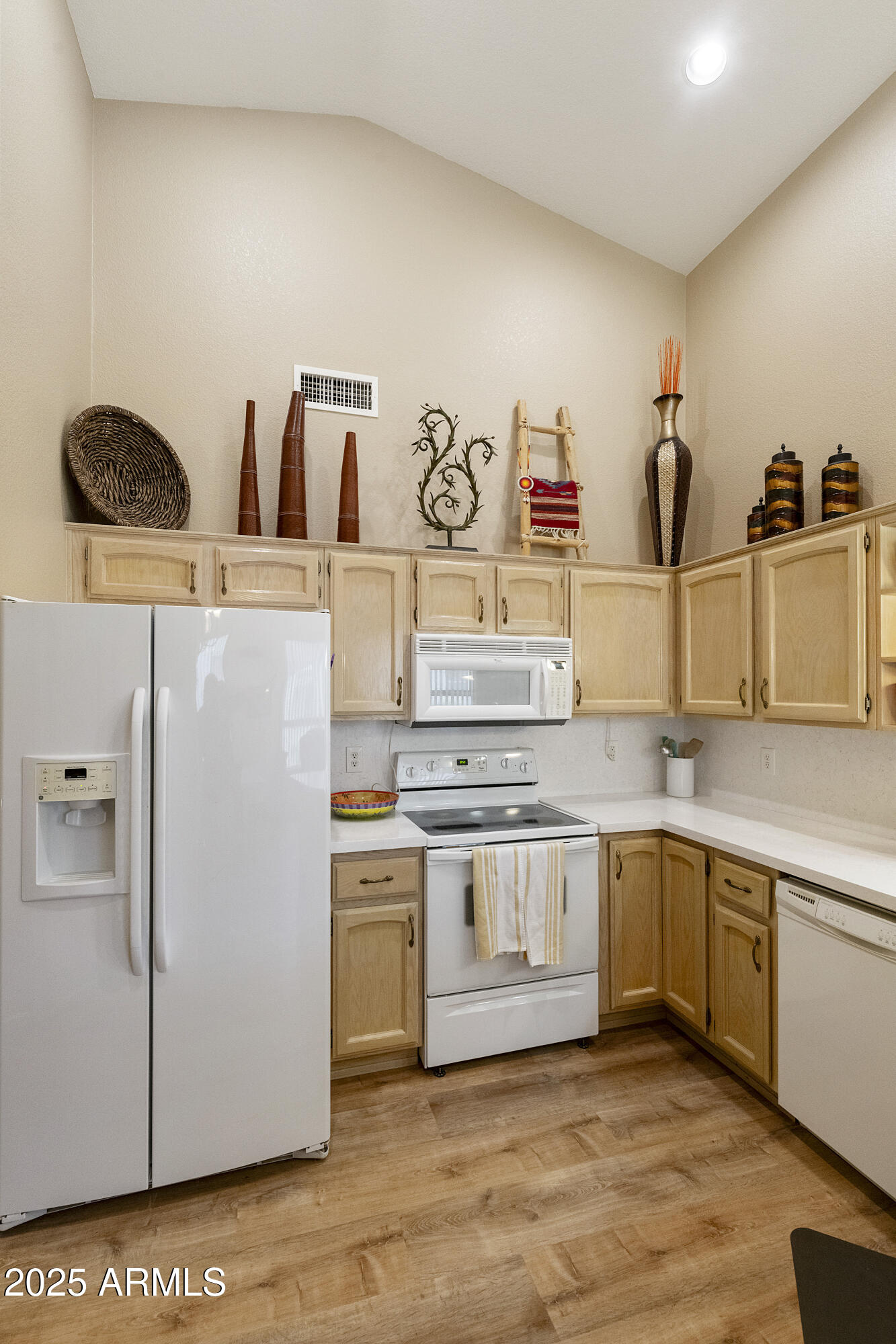 23745 South Vacation Way Sun Lakes, AZ 85248 - Photo 11 of 52 a kitchen with appliances a sink and cabinets