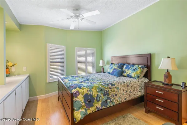 a bedroom with a bed and a table in it