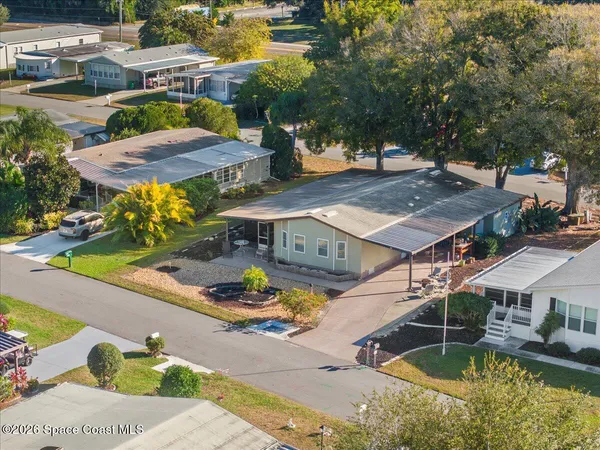 an aerial view of a house with swimming pool