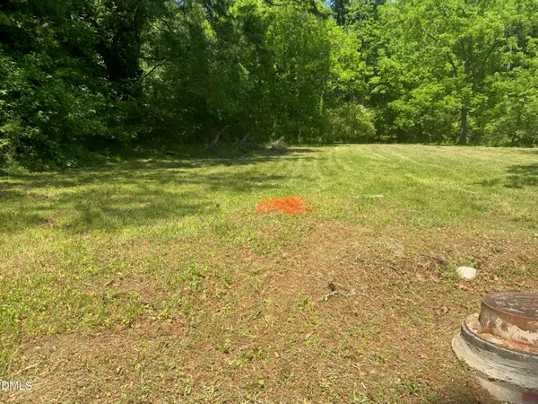 a view of a field with an outdoor space