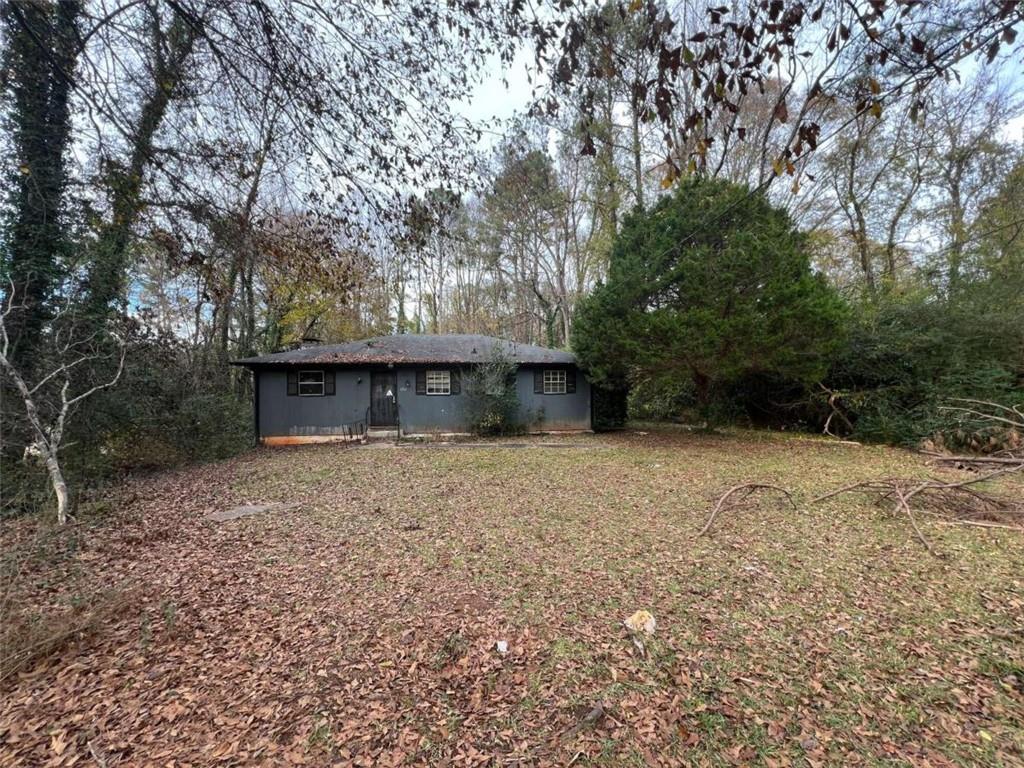 1702 Snapfinger Road Decatur, GA 30032 - Photo 1 of 1 a view of a backyard with large trees