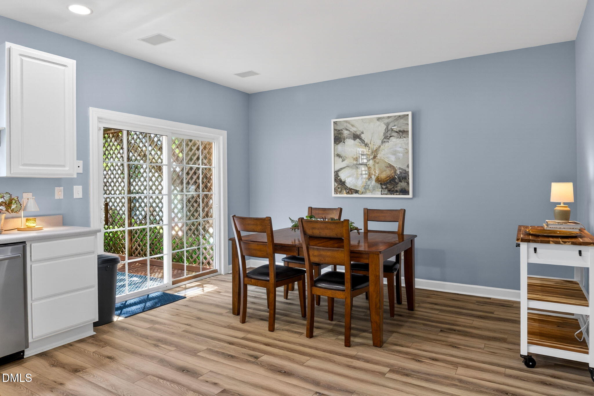 5500 Vista View Court Raleigh, NC 27612 - Photo 14 of 38 a view of a dining room with furniture window and wooden floor