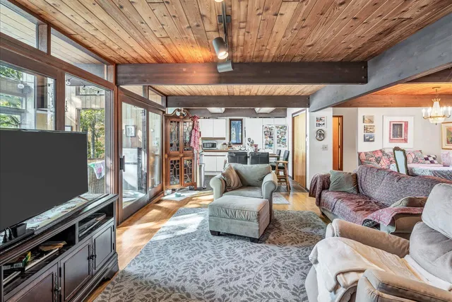 a view of a dining table and chairs in a patio