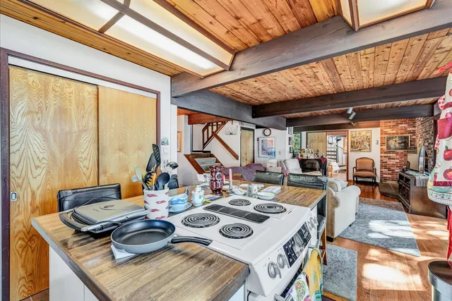 a bed room with a bed and a large window