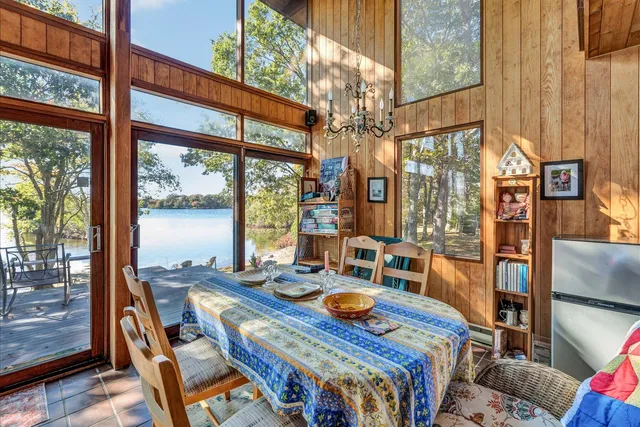 a bedroom with a bed and a dresser in it