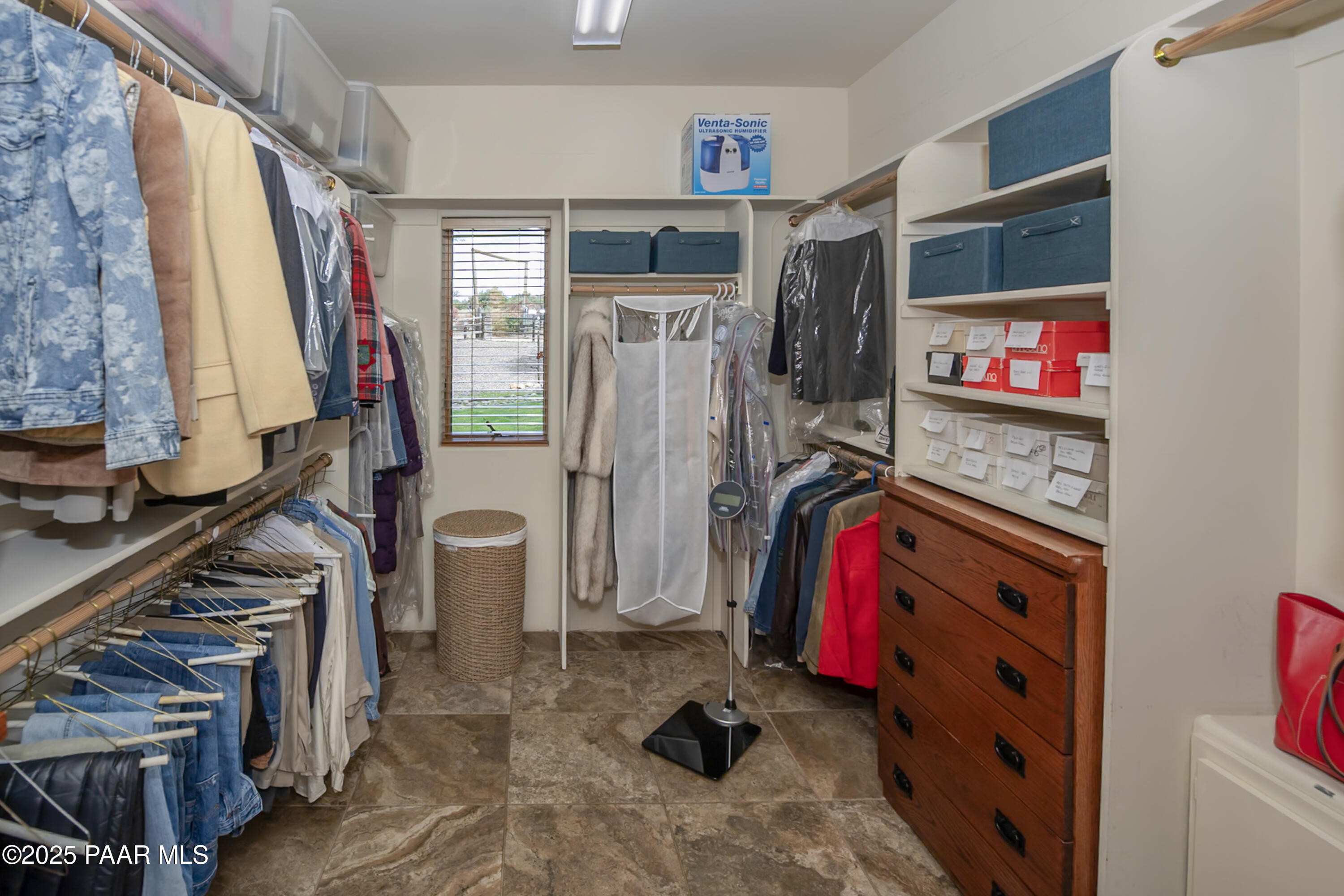 770 Grisby Road Skull Valley, AZ 86338 - Photo 23 of 58 a view of walk in closet with clothes and shoes
