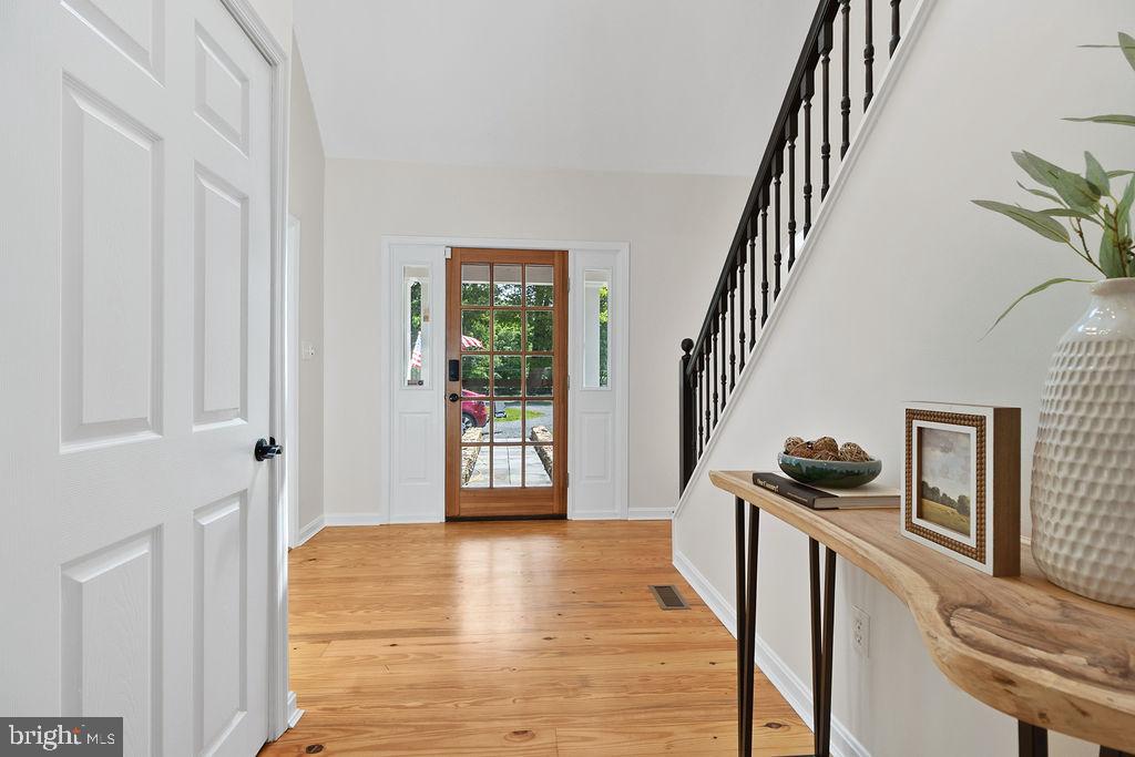 19821 Foggy Bottom Road Bluemont, VA 20135 - Photo 46 of 92 a view of an entryway with wooden floor and stairs