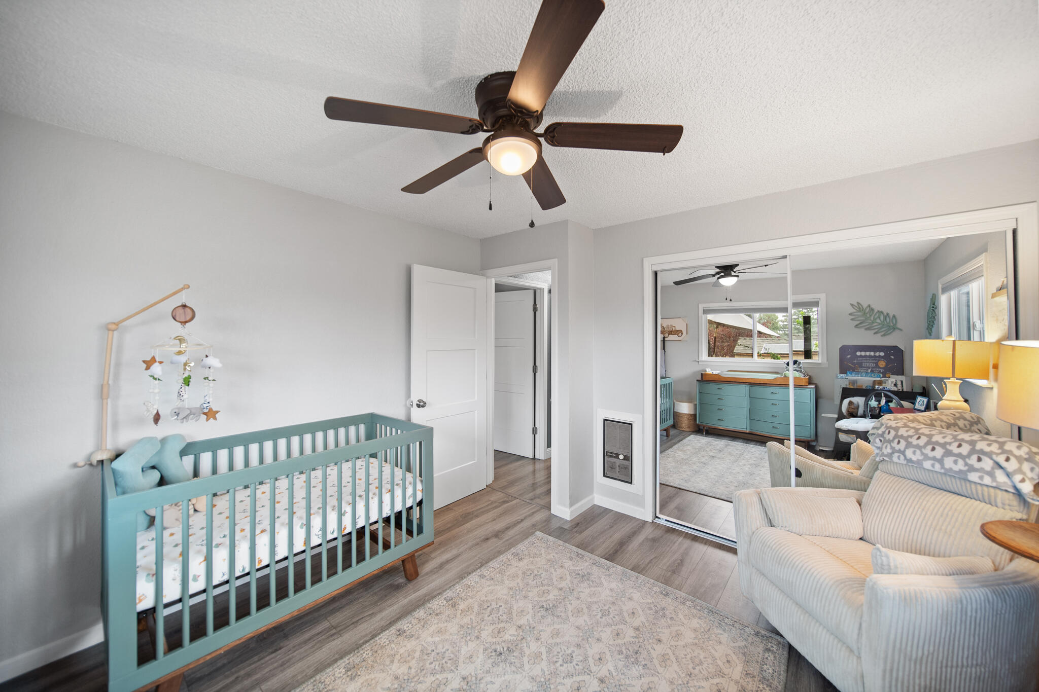 3922 Laredo Street Shasta Lake, CA 96019 - Photo 18 of 35 a bedroom with furniture and baby crib