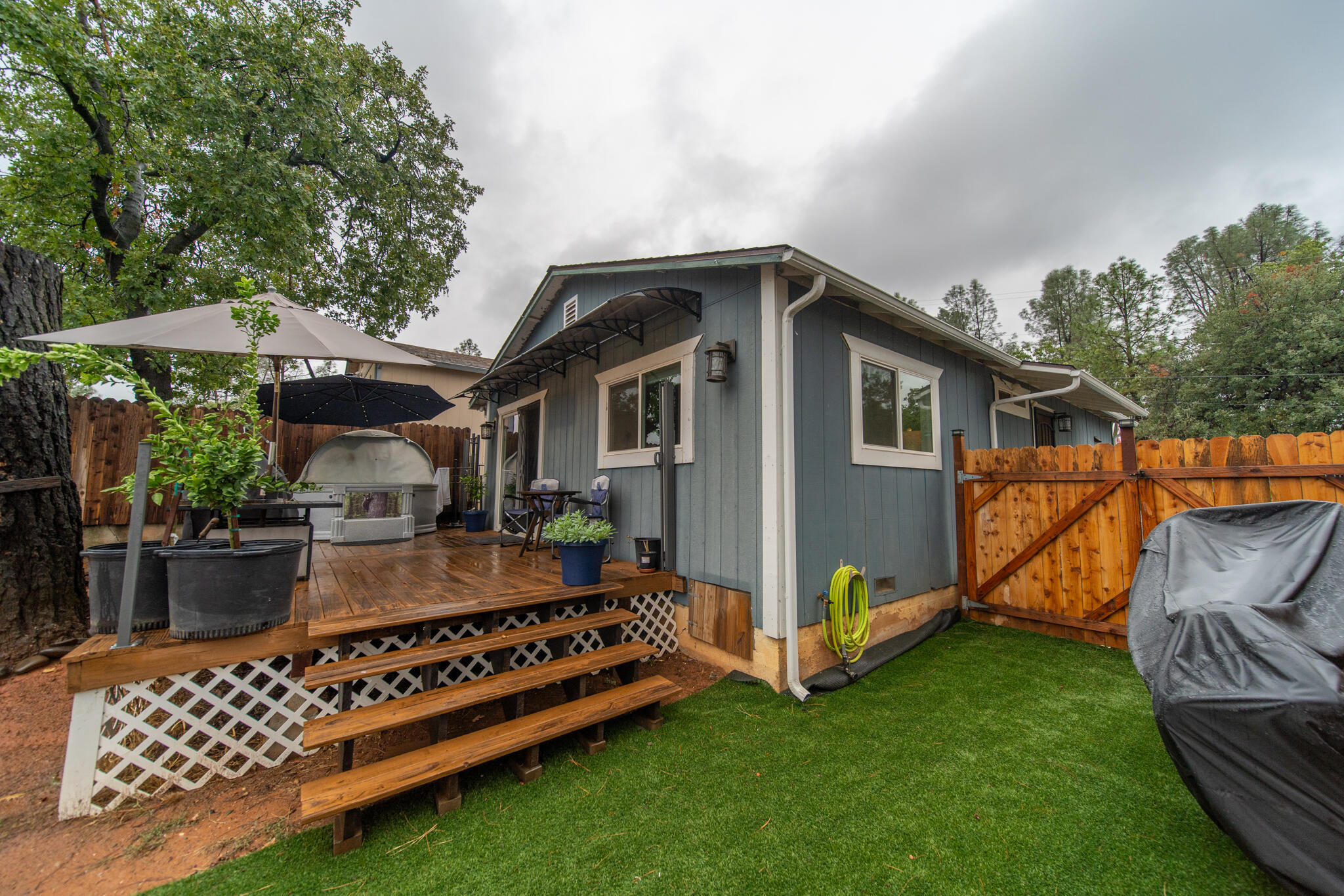 3922 Laredo Street Shasta Lake, CA 96019 - Photo 23 of 35 a front view of a house with garden
