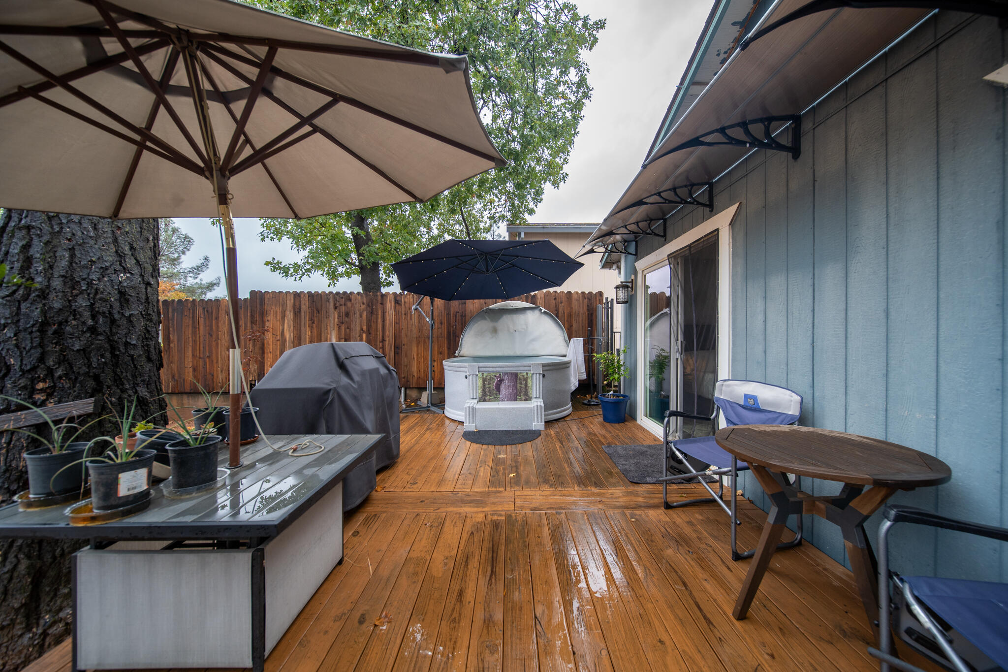3922 Laredo Street Shasta Lake, CA 96019 - Photo 24 of 35 a view of a patio with furniture and a umbrella