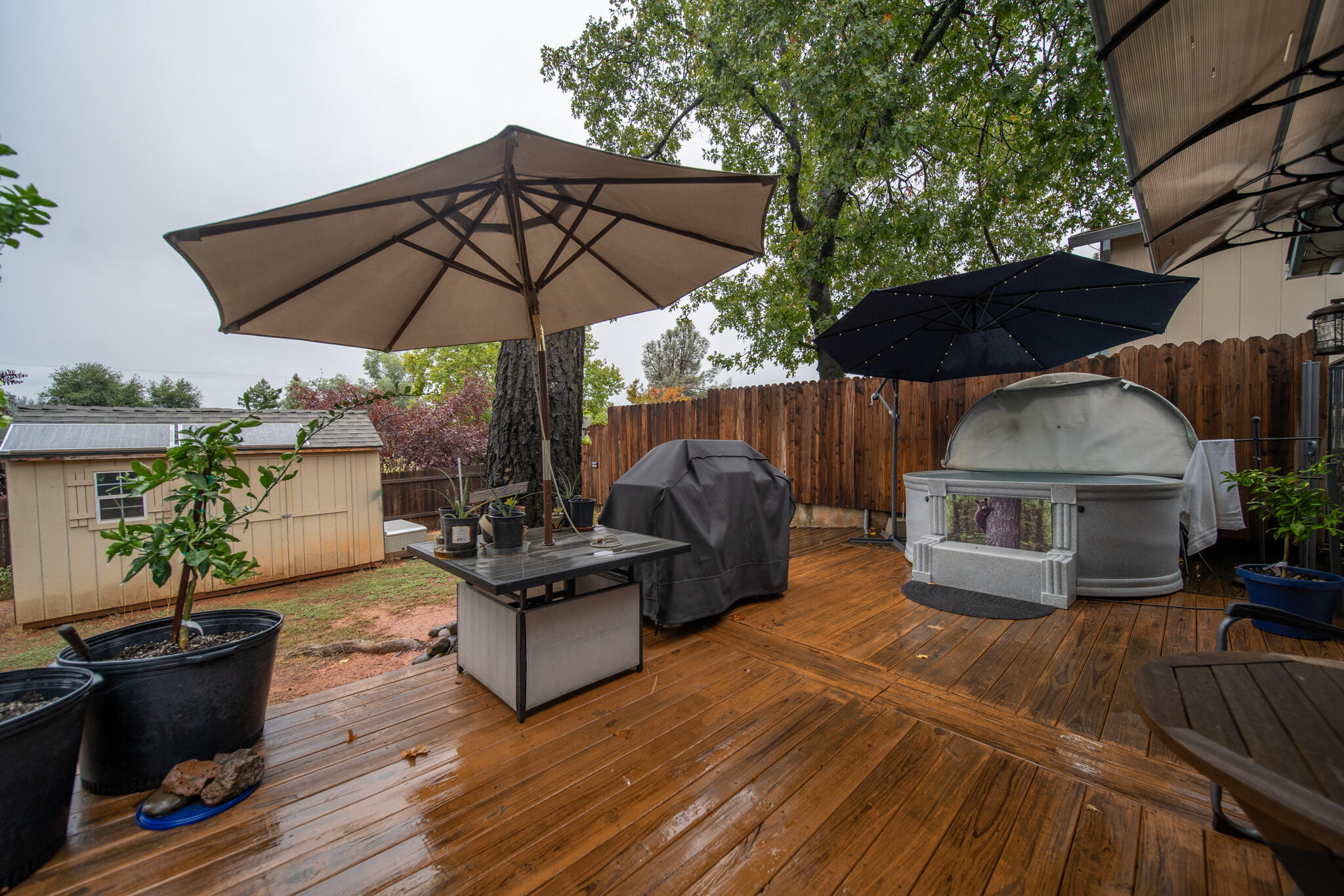 3922 Laredo Street Shasta Lake, CA 96019 - Photo 25 of 35 a view of a patio with couches under an umbrella