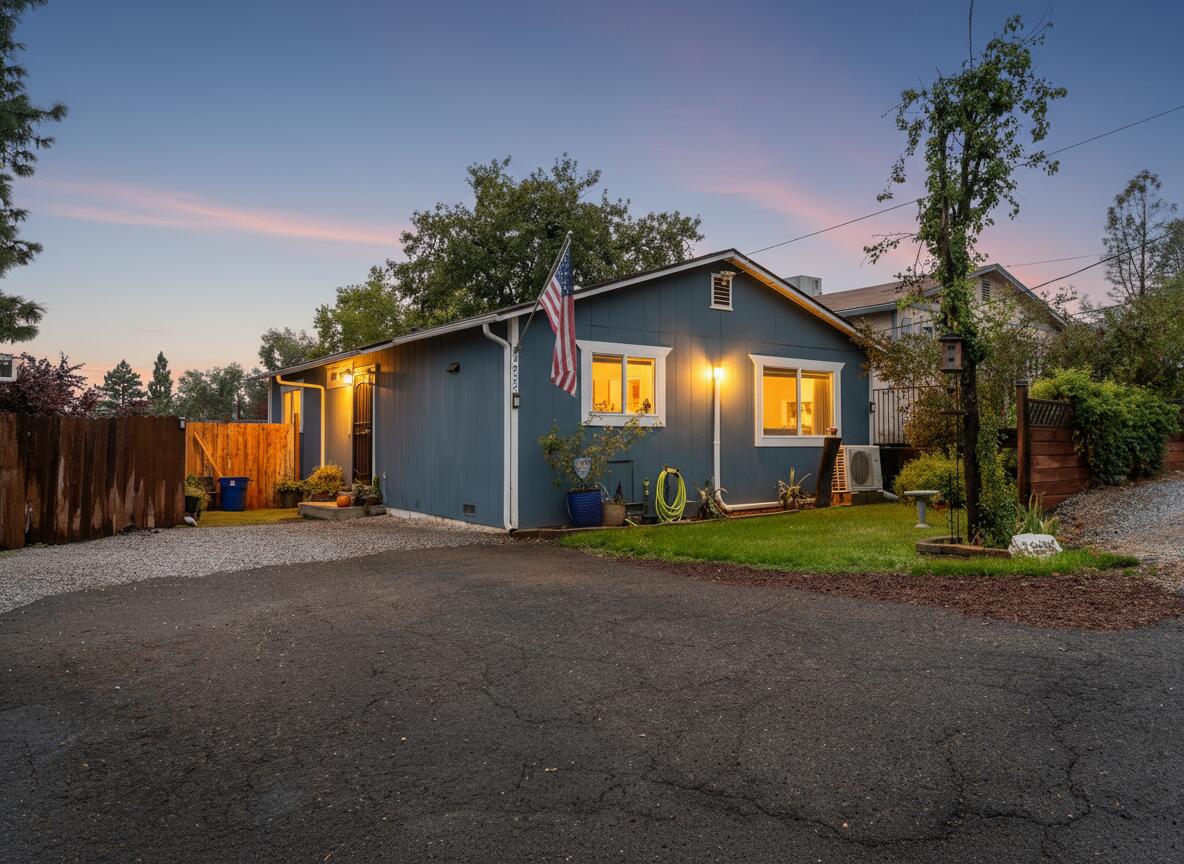3922 Laredo Street Shasta Lake, CA 96019 - Photo 3 of 35 a front view of a house with a yard and garage