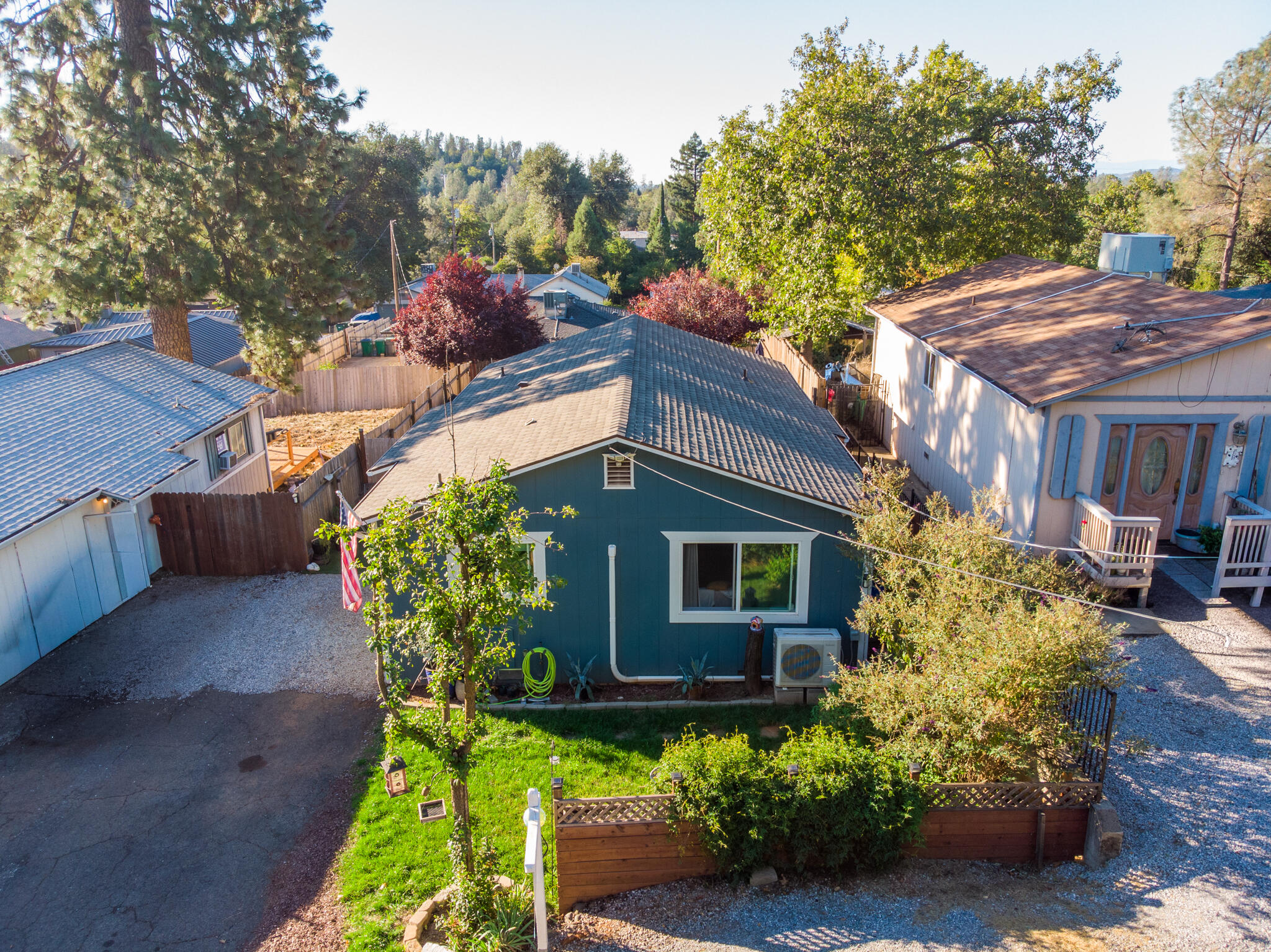 3922 Laredo Street Shasta Lake, CA 96019 - Photo 35 of 35 a front view of a house with a yard and outdoor seating
