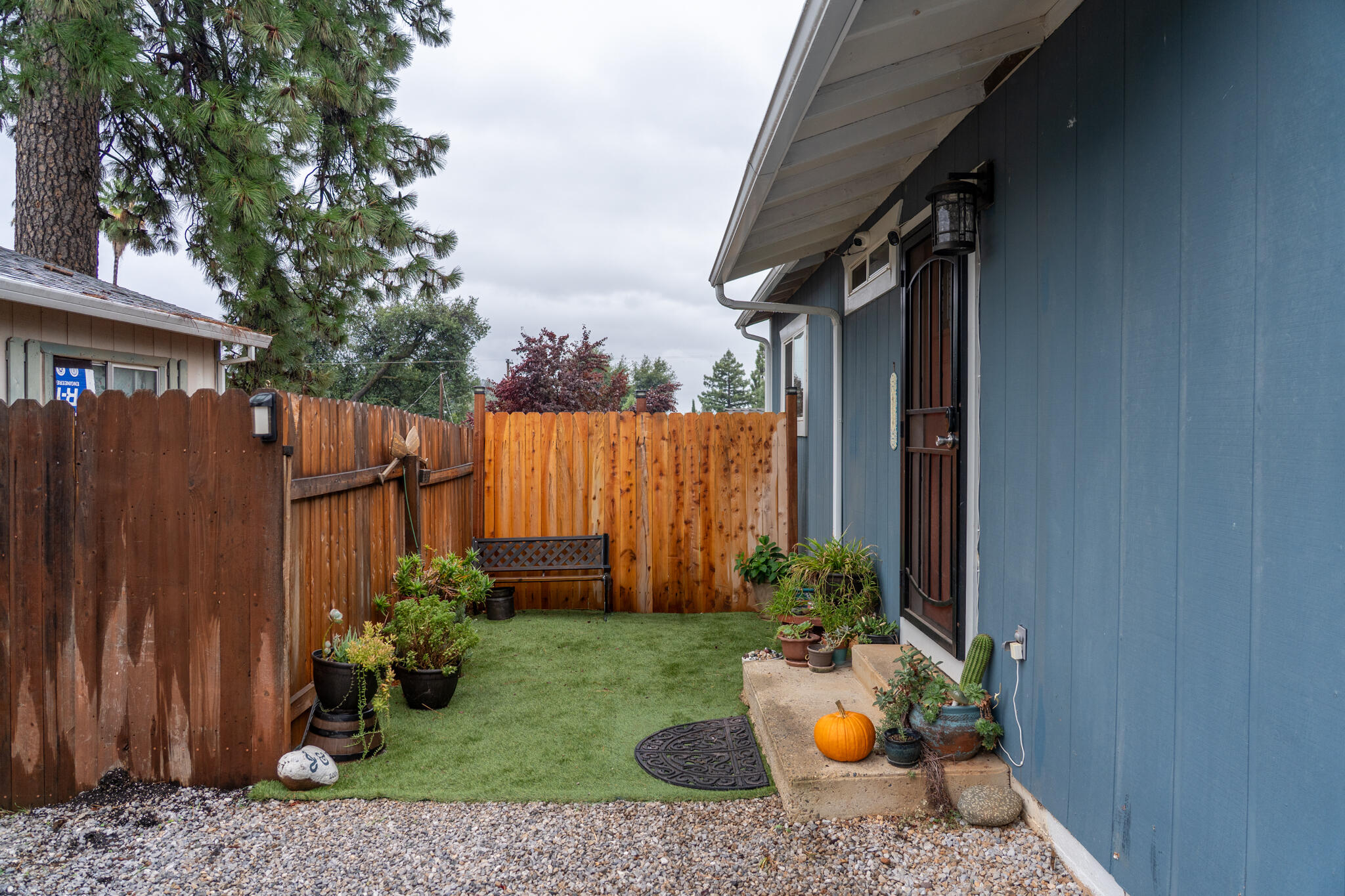 3922 Laredo Street Shasta Lake, CA 96019 - Photo 5 of 35 a backyard of a house with table and chairs