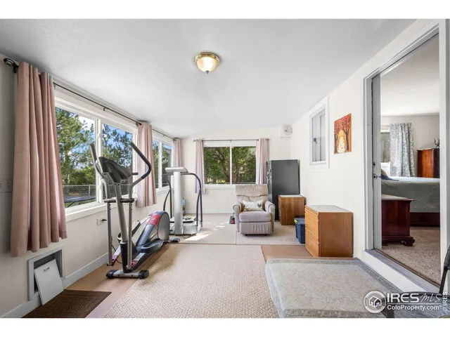a view of a livingroom with furniture and windows